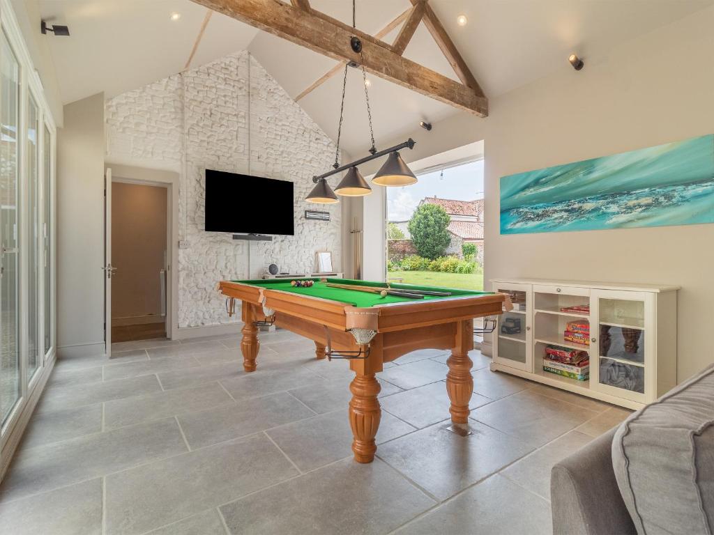 The full-size pool table in the games room