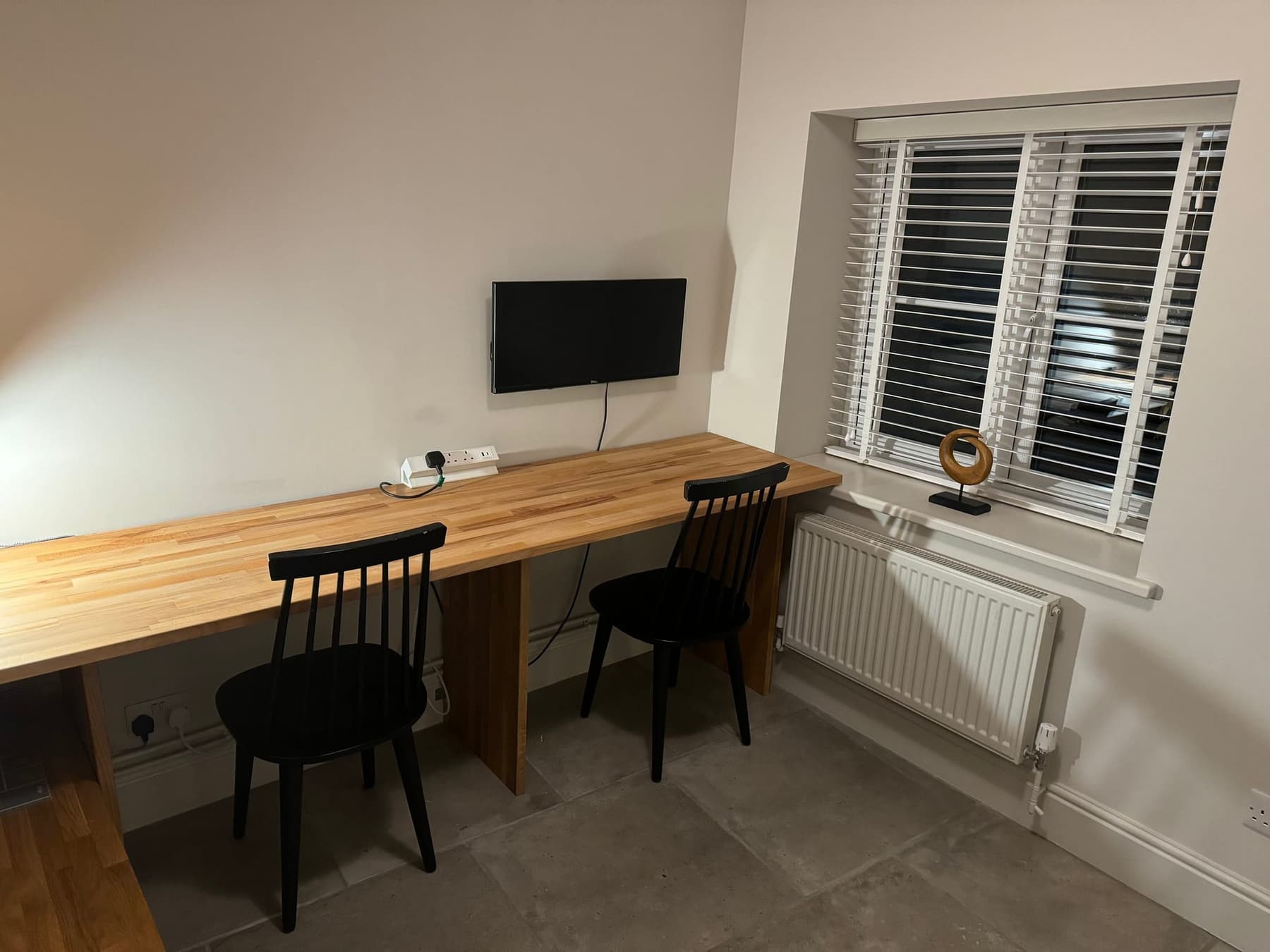 The long work bench at South Creek Retreat, with a screen above it