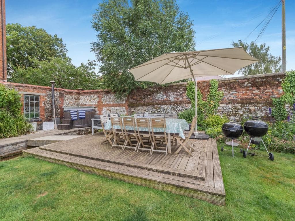 The garden deck, with the barbecue and long table