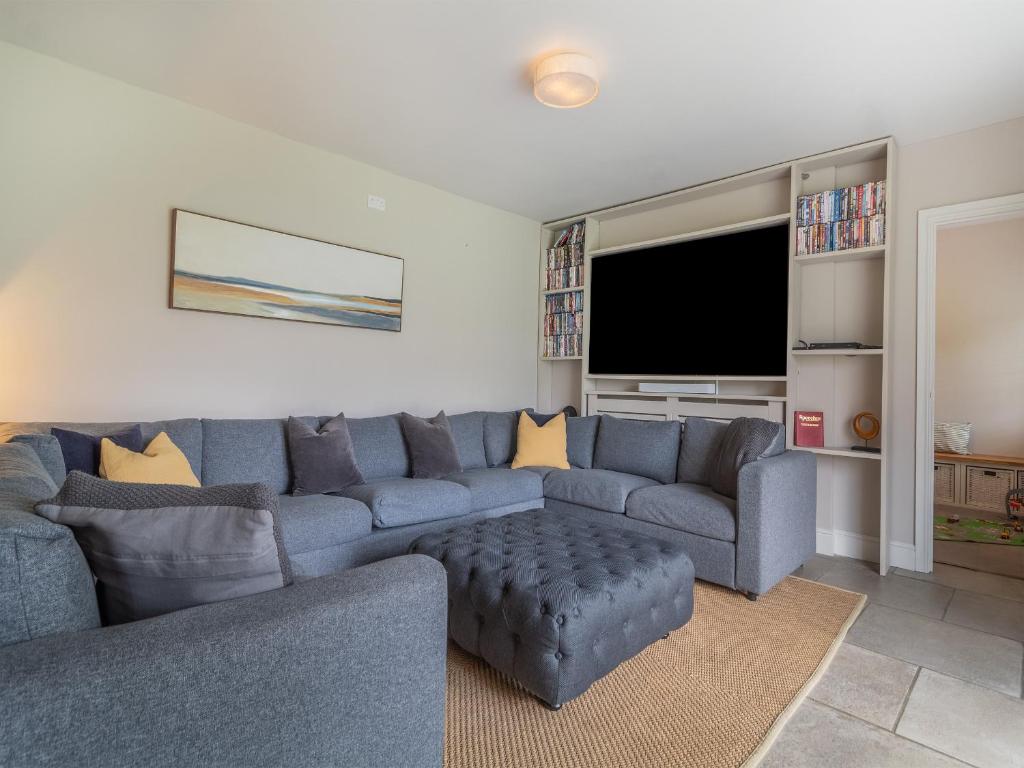 The television lounge, with corner seating for the whole team